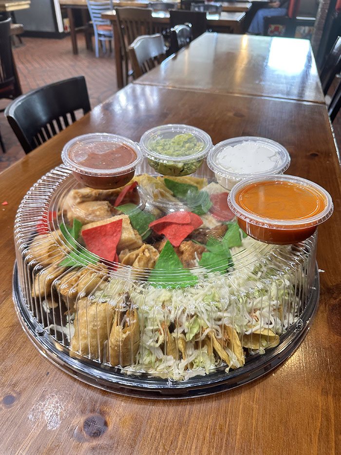 Sealed Party Platter tray with lid and dip cups, ready for pickup or delivery